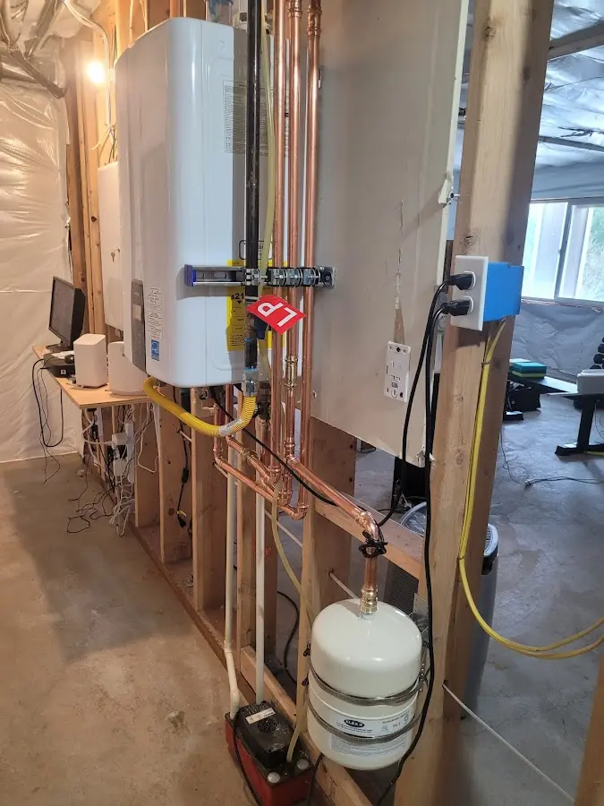 Licensed plumber repairing a kitchen sink in Ranlo