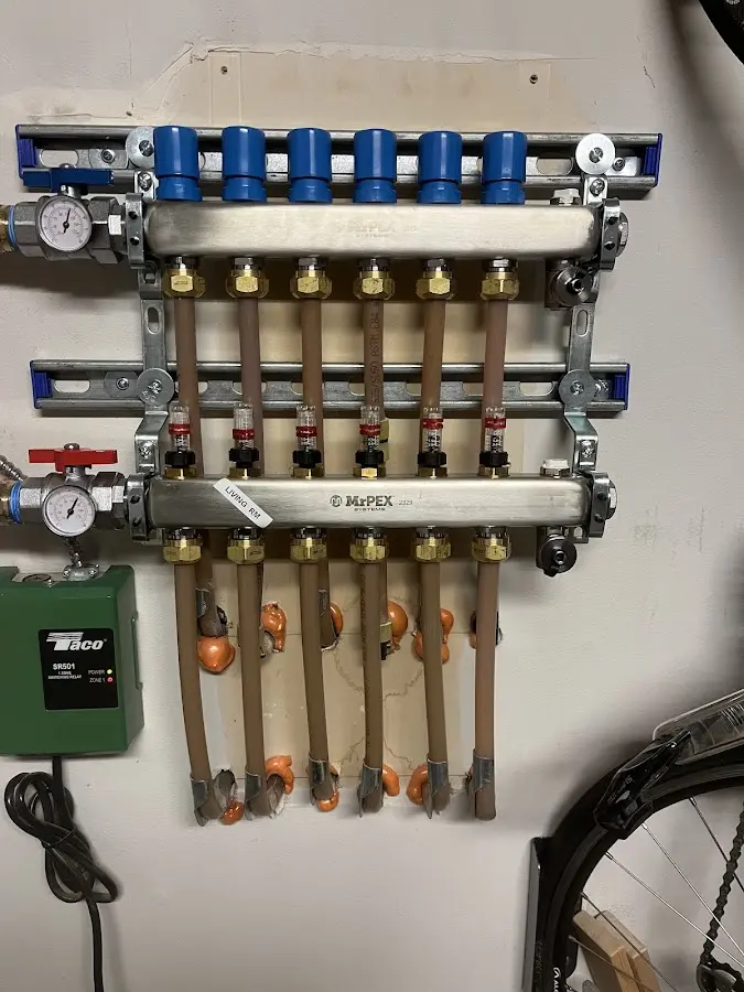 Plumber performing Water Heater Repair at a residential property in Ranlo